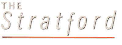 The image shows a logo with the text "THE Stratford" in black and orange colors.